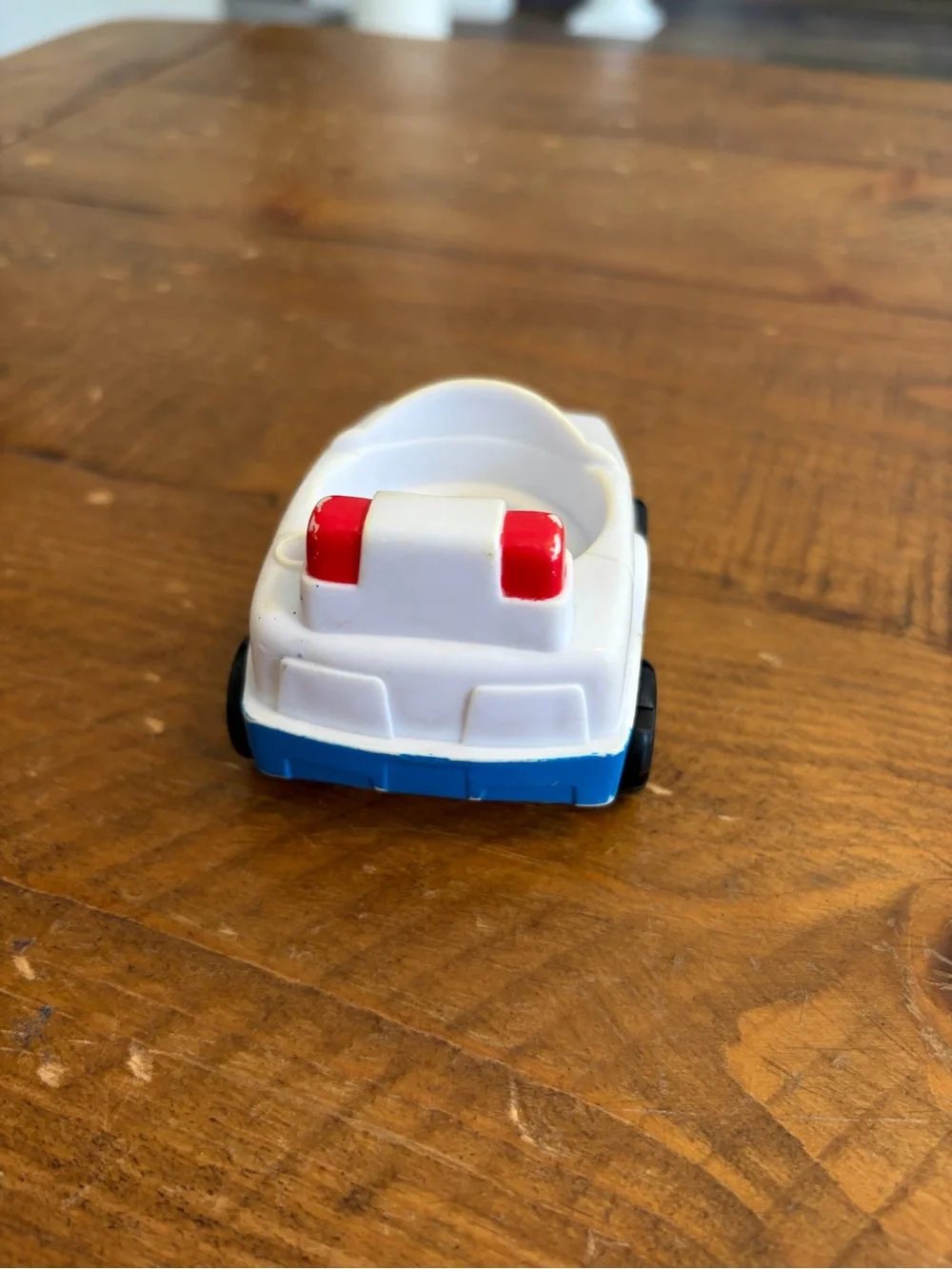 Fisher Price Little People police car as is. Has areas of yellowing see pictures